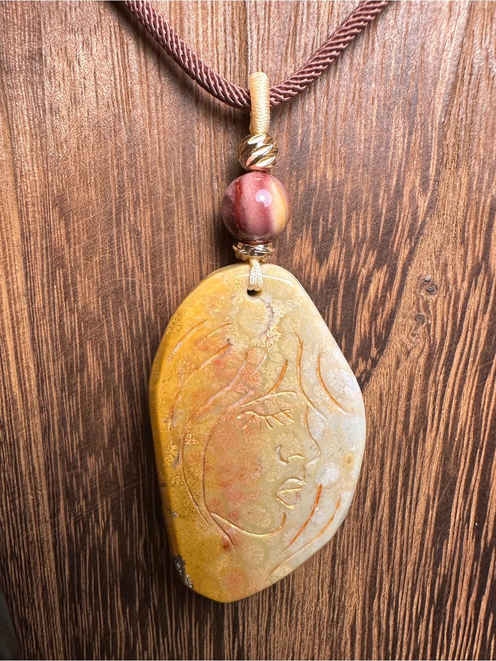 Coral Fossil Lady Profile Pendant Necklace on Brown Rope - Picture 3 of 14